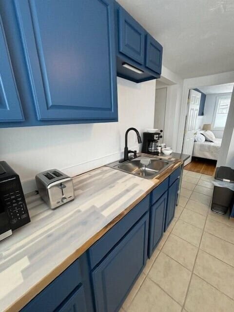 kitchen with view of hallway and bedroom 1