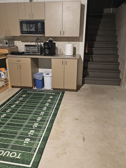 Stairs are entry and exit, with kitchenette
