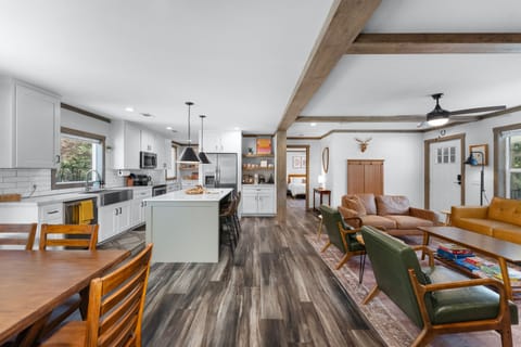 The large living space includes the dining area, the kitchen and living room.