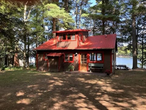 back of cottage from driveway with space for 3 cars