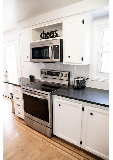 A clean flat top range with oven is available. There is also a toaster.