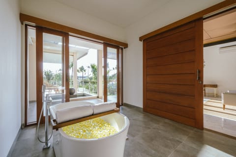 Master bathroom with bathtub 