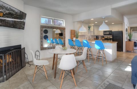 Dining Space with Fireplace, Smart TV, Breakfast Bar and Open Views of the Kitchen and Living Room - Seating for four (4) at the Dining Table & Seating for Four (4) at the Breakfast Bar