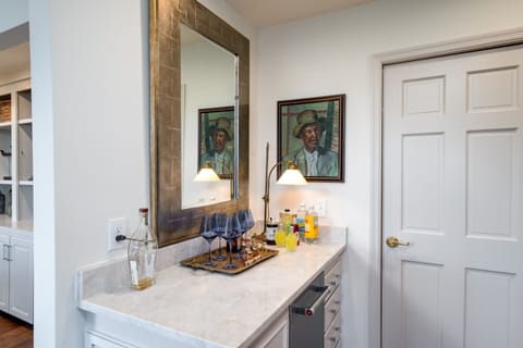 Tucked around the corner from the dining area is the bar. Beverage refrigerator is a bonus