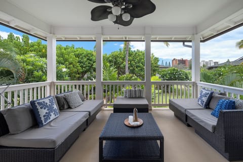 Unwind on the spacious private lanai with plush seating and lush views—your open-air living room in paradise.