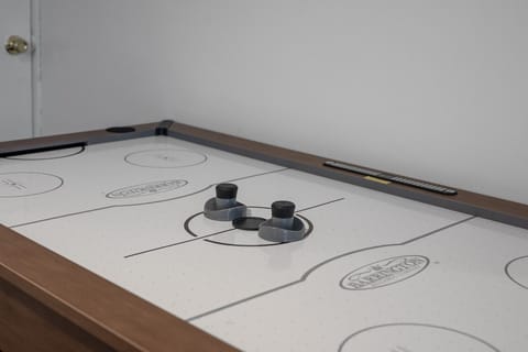 Battling it out on the air hockey table!