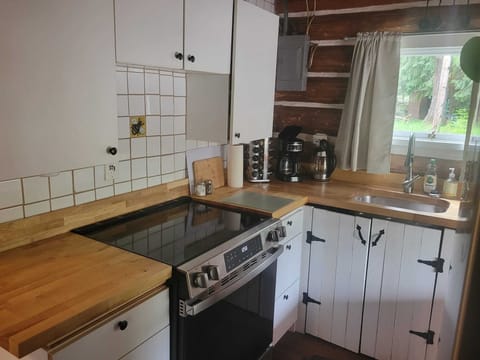 Full kitchen with stove, oven, coffee maker & cookware
