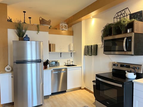 Our kitchen has new full size stainless steel appliances.