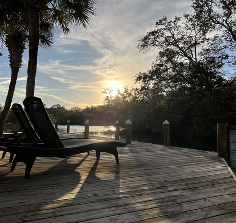 Peaceful views! Uncovered deck space with 2 loungers in front of unit.