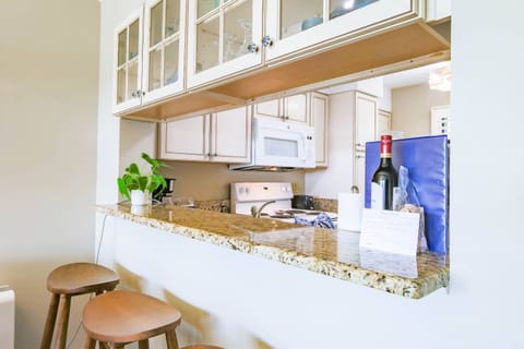 This counter with stool seating connects the dining area to the kitchen.