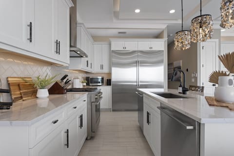 Luxury kitchen featuring GE Monogram appliances, including TWO dishwashers. 