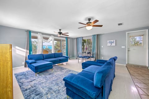 Spacious Living room with 2 brand new couches, new carpet, new fans and drapes. 