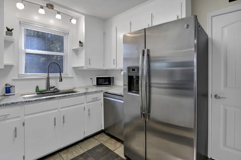 Fully Stocked Kitchen with Stainless Steel Appliances