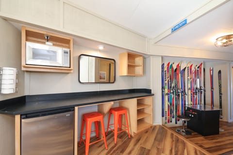 Basement bar area with mini fridge