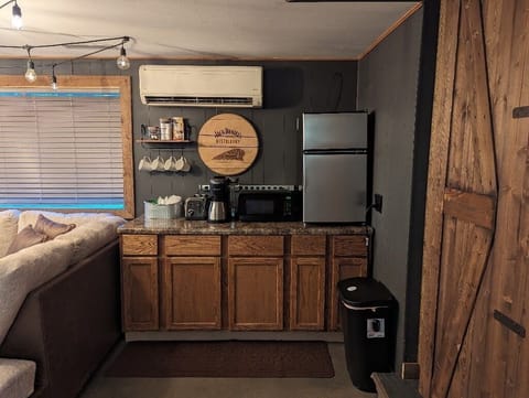 Kitchenette ~ mini fridge/freezer, microwave, drip or pod coffee, and toaster.