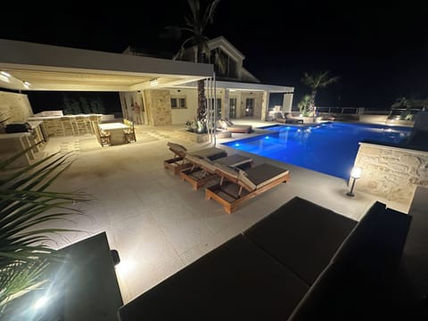 Night time poolside relaxation area