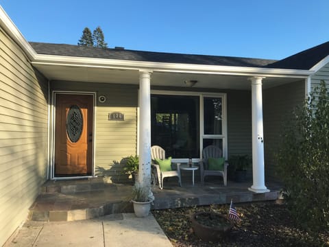 Front entrance by rose/flower garden with off road parking for two+
