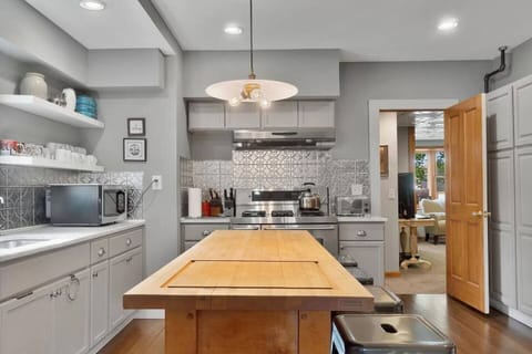 The kitchen's butcher block island makes prep easy and allows conversations to flow.