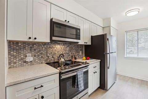 New cabinets and modern stainless appliances