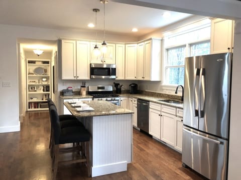 Open concept kitchen/living room/dining area. Fully stocked kitchen.
