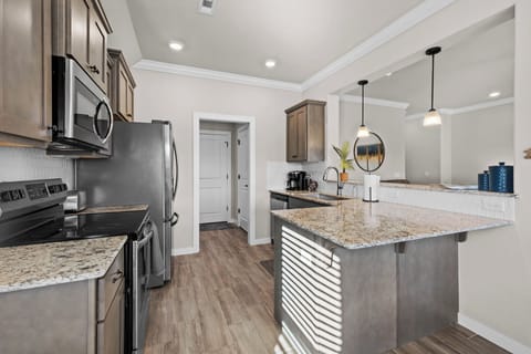 Kitchen leads to laundry room, pantry, & garage with game room!