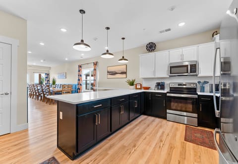 Open and airy, this kitchen is designed for cooking and gathering, making it the heart of the home.