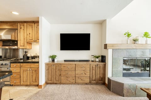 55" Smart TV with a soundbar and cable