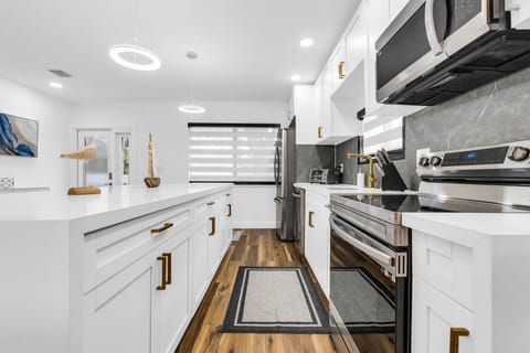 Fully remodeled kitchen with appliances, pots/pans, cooking utensils, etc