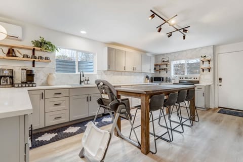 Gather around our dining table, perfect for enjoying meals and conversations. The inviting setting ensures every meal is a delightful experience, creating moments to savor.