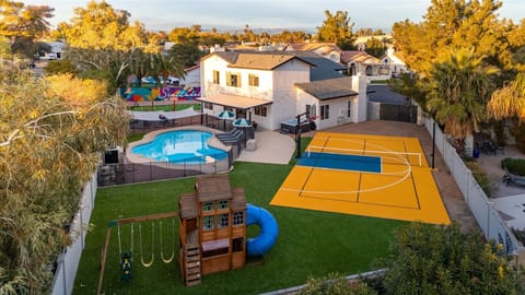 Massive outdoor oasis awaits your stay! Pickleball, basketball, firepit area, heated pool, putt putt, playground, or lounge chairs- Take your pick!