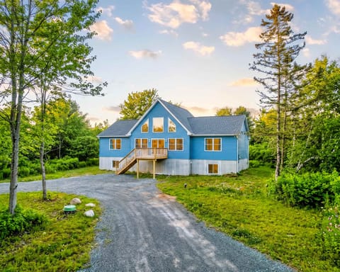 Blue Lake House Exterior Surrounded by Nature