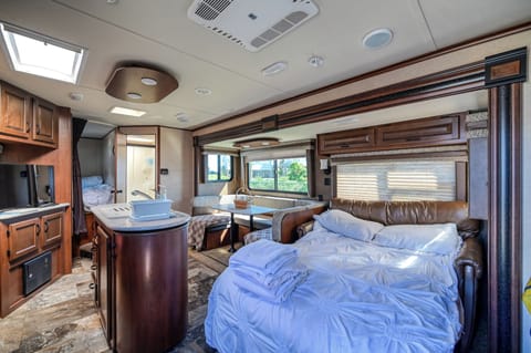 The sun-lit camper welcomes you to enjoy it.