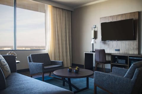 Stretch out in a cozy sitting area beside sunny windows.