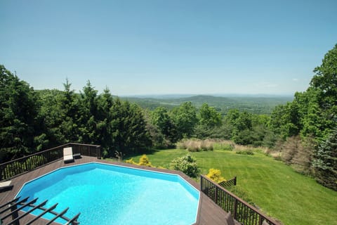 Gorgeous view of the pool and yard. Pool is open Memorial - Labor Day.