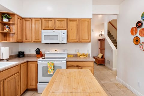 Kitchen looking to dining area and stairwell