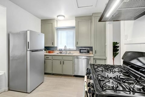 Experience the heart of our home in our kitchen and dining area, where modern appliances meet a warm, welcoming dining space for your culinary adventures.
