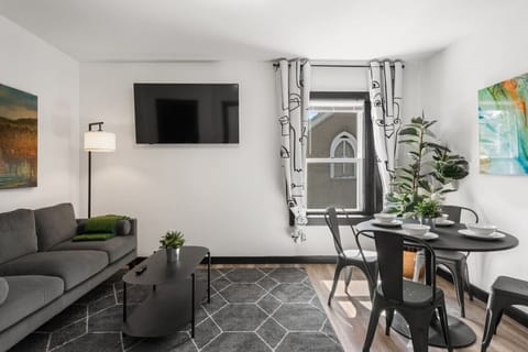 ✨ Stylish Living Space | Enjoy modern décor, colorful artwork, and cozy comfort in this welcoming area made for connection.