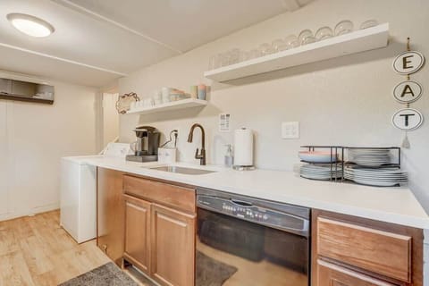 Indulge in Culinary Adventures in this Spacious Kitchen Flooded with Natural Light - the Perfect Ambiance for Cooking Enthusiasts!