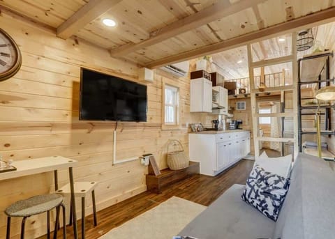 Nestle into comfort at Red Rock Roost's cozy living area – where relaxation meets charm in every corner.