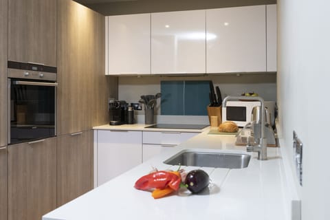 Kitchen with microwave, oven, stove & fridge  - Rockpool at Salt