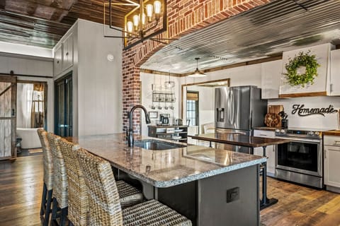 Modern farmhouse kitchen is fully equipped with everything you need to make meals.