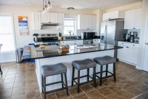 2nd and 3rd floor have identical kitchens w/large island and beach views.