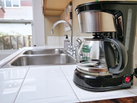 Your mornings are made simple with a coffee maker ready to brew your first cup of the day. ☕