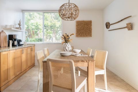 A dinning table off of the kitchen that comfortably accommodates 6 people.