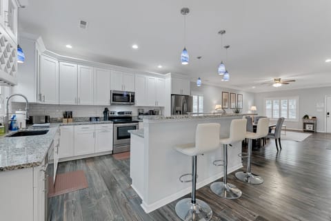 Gather around the kitchen island for casual meals and conversations.