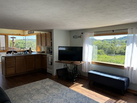The huge windows make the living space bright - great views of the bay!