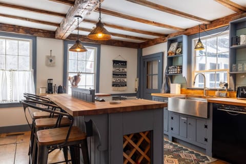 The kitchen with island seating for three.