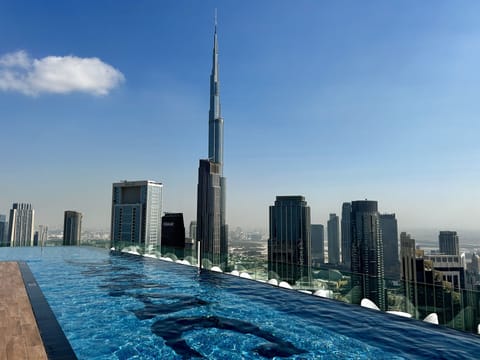 Infinity pool on the 64th floor with stunning Burj Khalifa views.