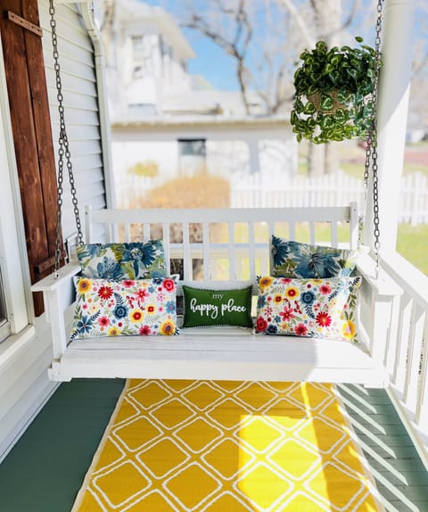 Unwind on the porch swing amid birdsong as neighbors walk their dogs.