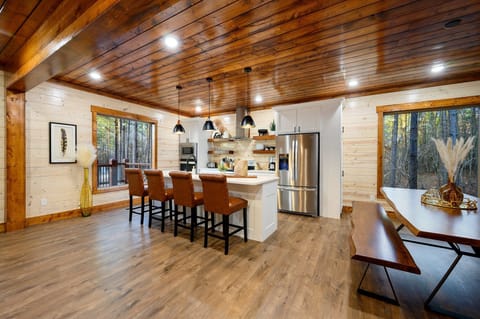 The kitchen has seating for 14 including the formal dining table and bar top.